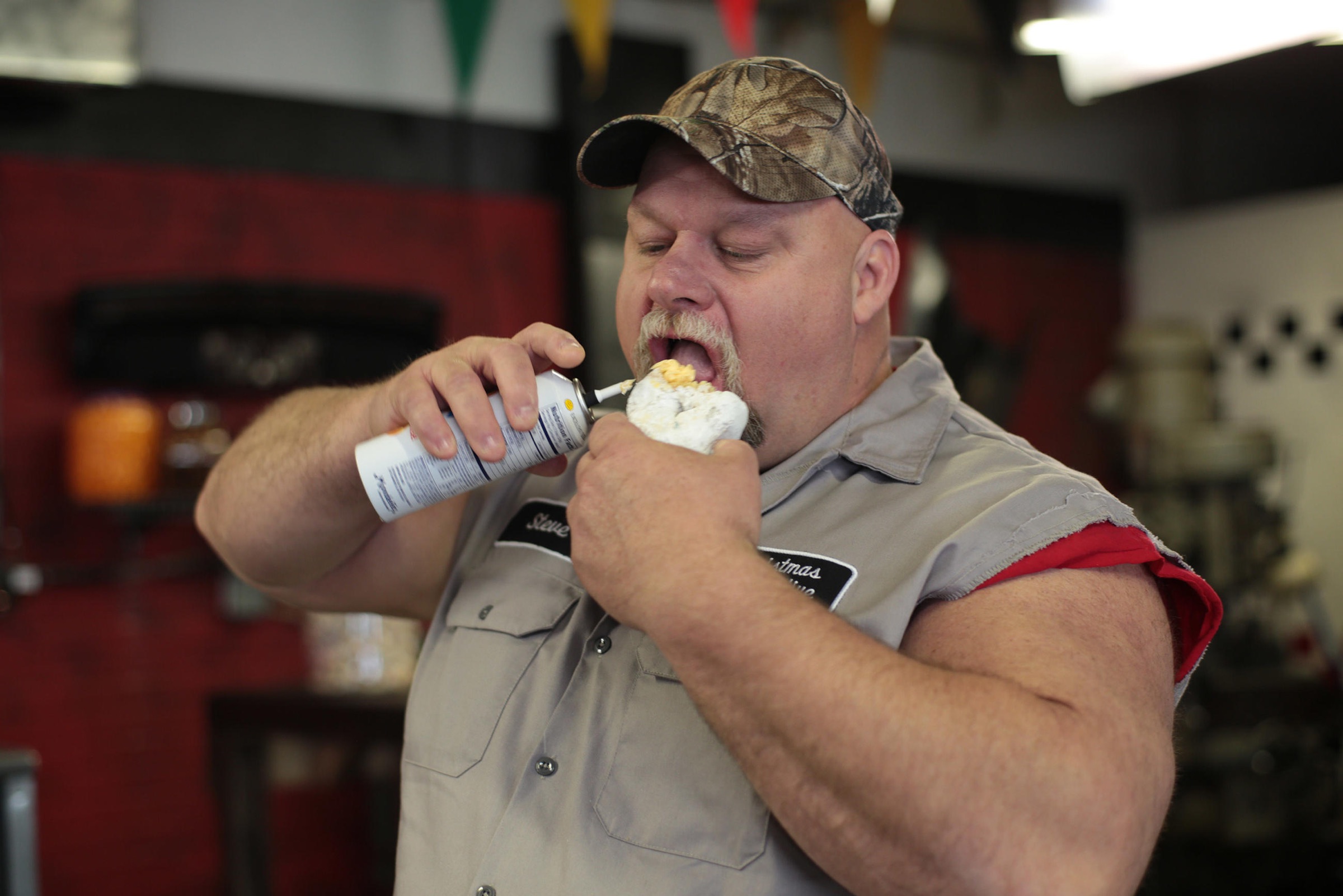 Fat Guy eating a donut and cheese-whiz